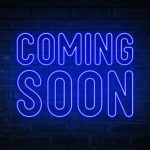 Coming soon - blue neon light word on brick wall background